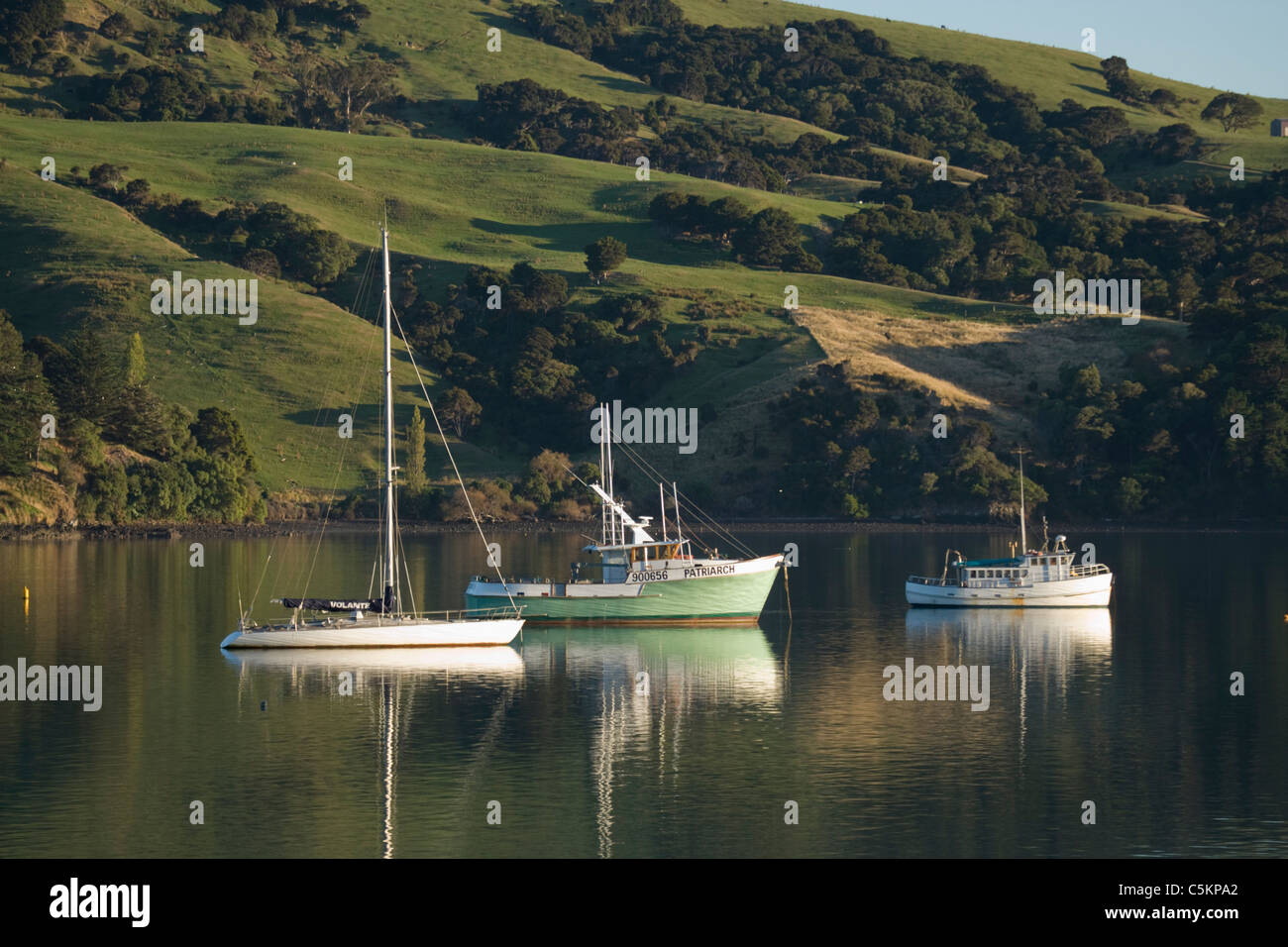 Three small boats at anchor, Lake Wanaka, New Zealand Stock Photo