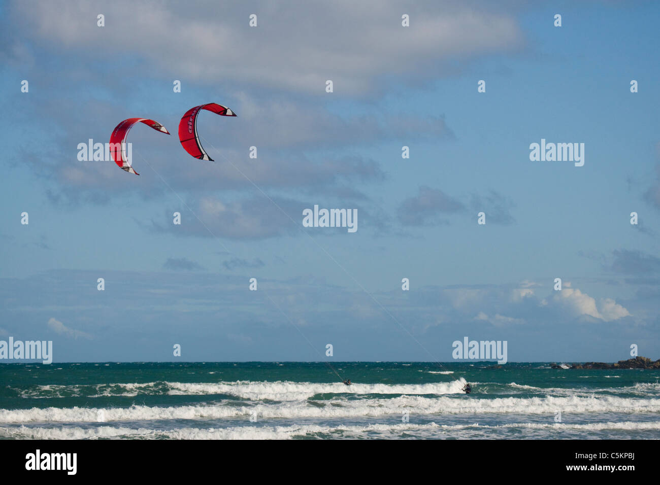 Two kite surfers in Lyall Bay, Wellington, New Zealand Stock Photo