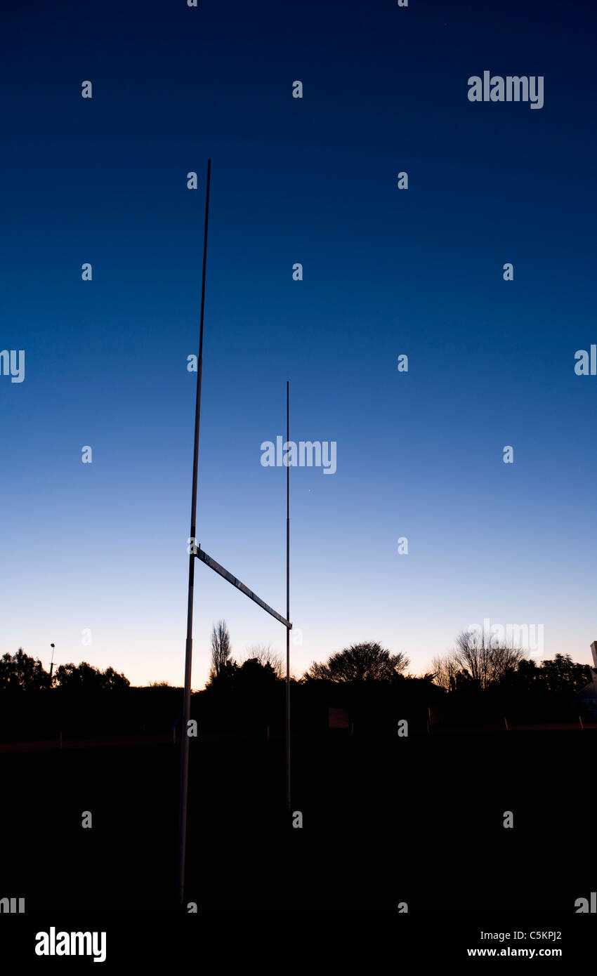 Rugby goalposts silhouetted against an evening sky, Edendale, Southland, New Zealand Stock Photo