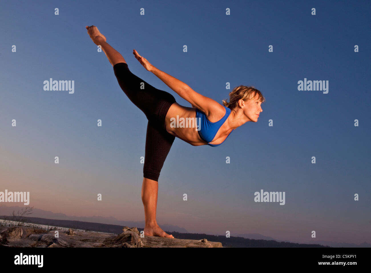 Balancing Stick Pose. Tuladandasana. Side View Of Woman Silhouette Doing  Yoga Outdoor At Morning Stock Photo, Picture and Royalty Free Image. Image  190680518.