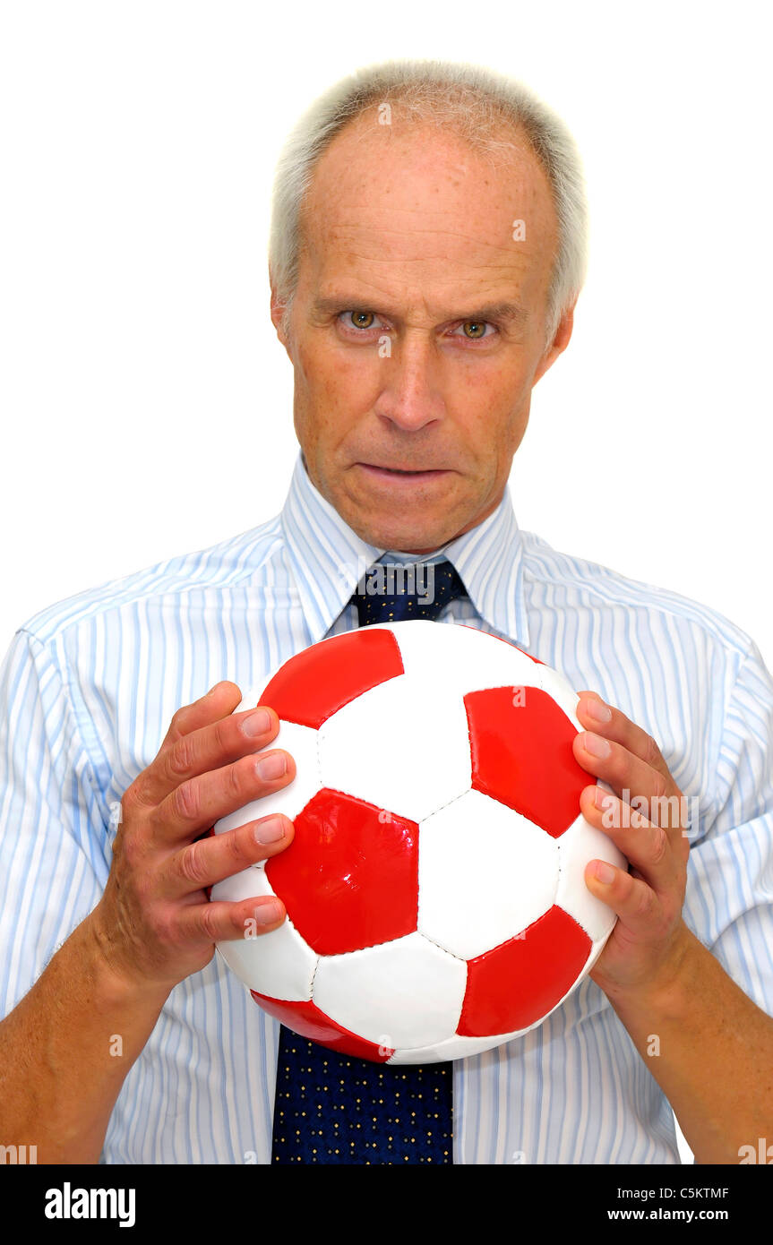 Businessman with a soccer ball isolated in white Stock Photo - Alamy