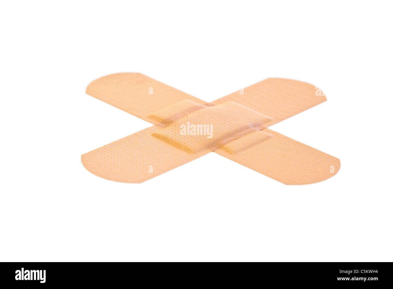 Cross-shaped band-aid Stock Photo
