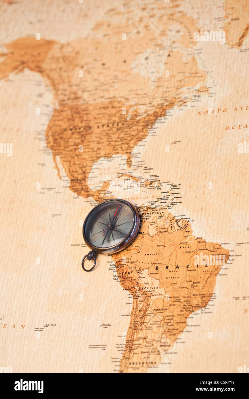 World map with compass showing North and South America Stock Photo