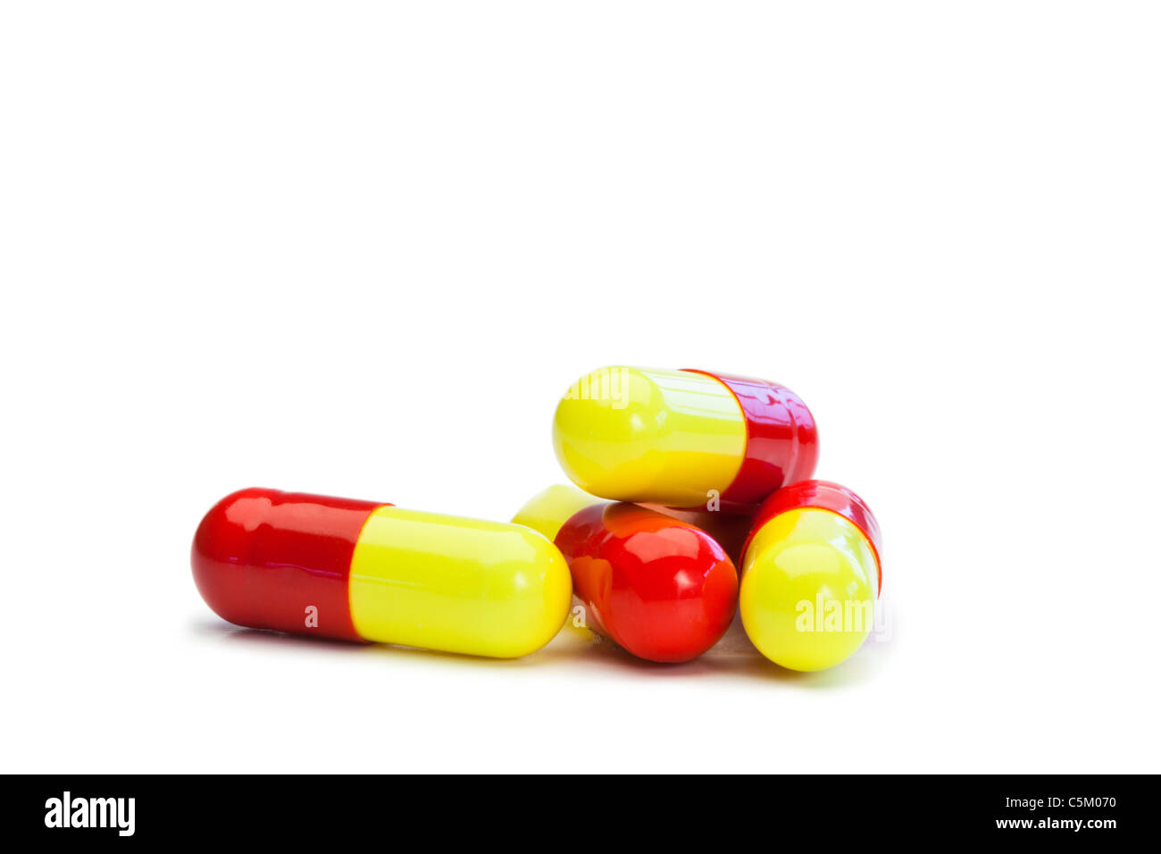 Yellow and red capsules Stock Photo Alamy