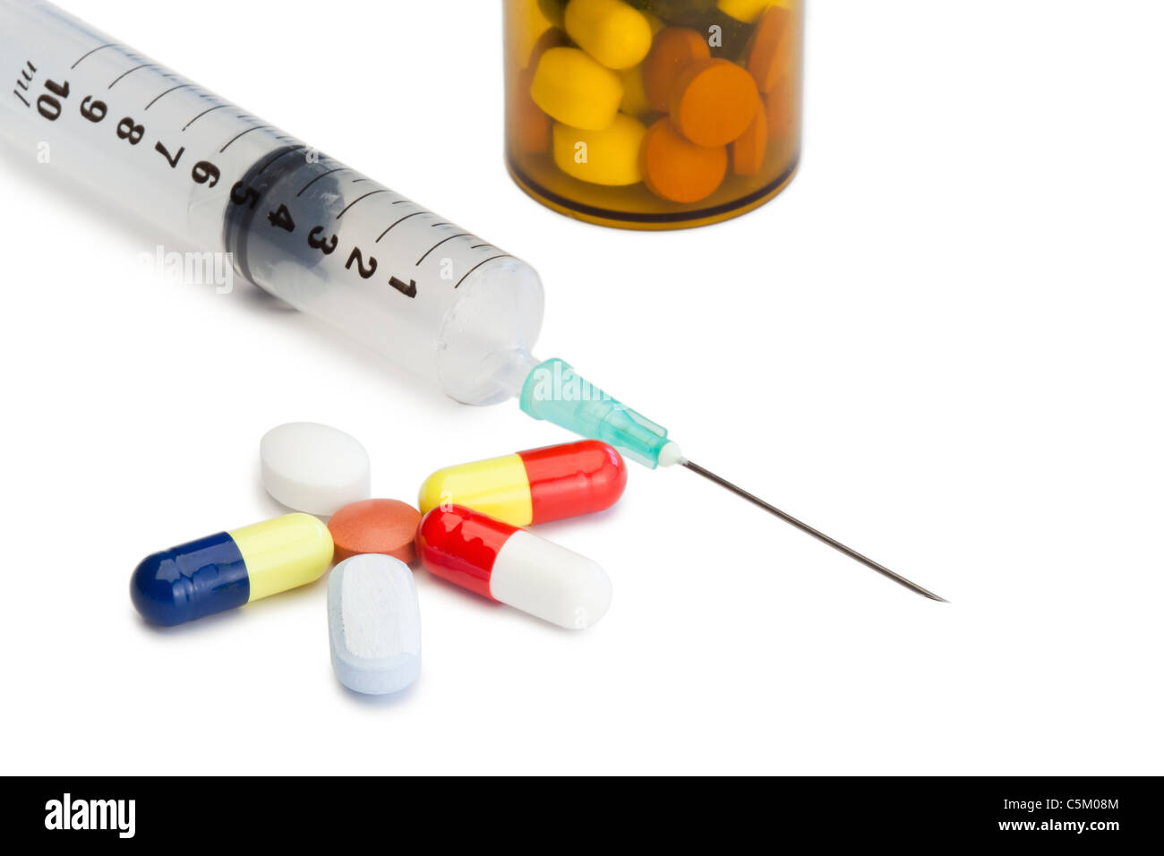 Pills with medicine box and syringe Stock Photo