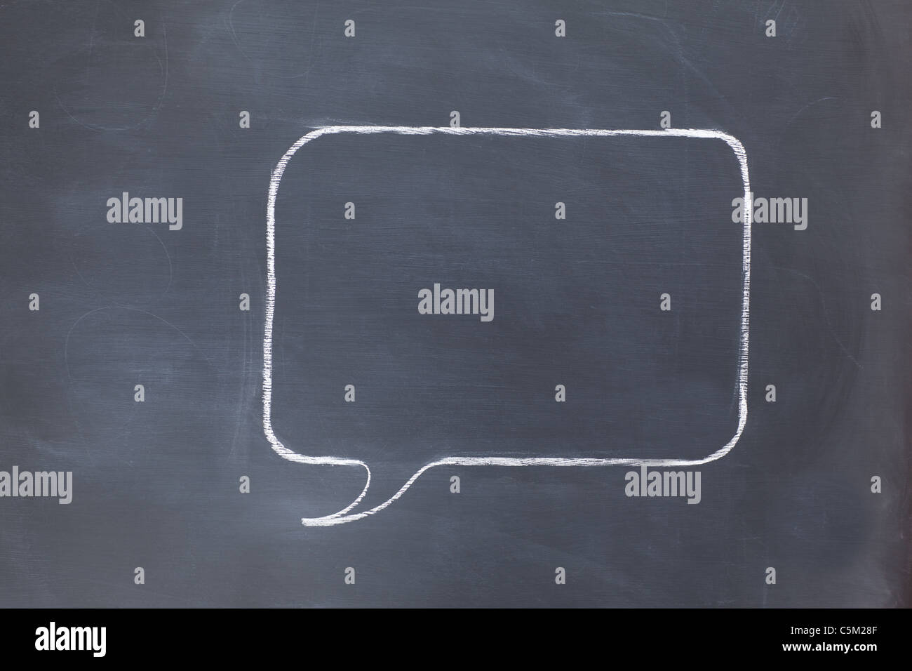 Empty square speech bubble on a blackboard Stock Photo