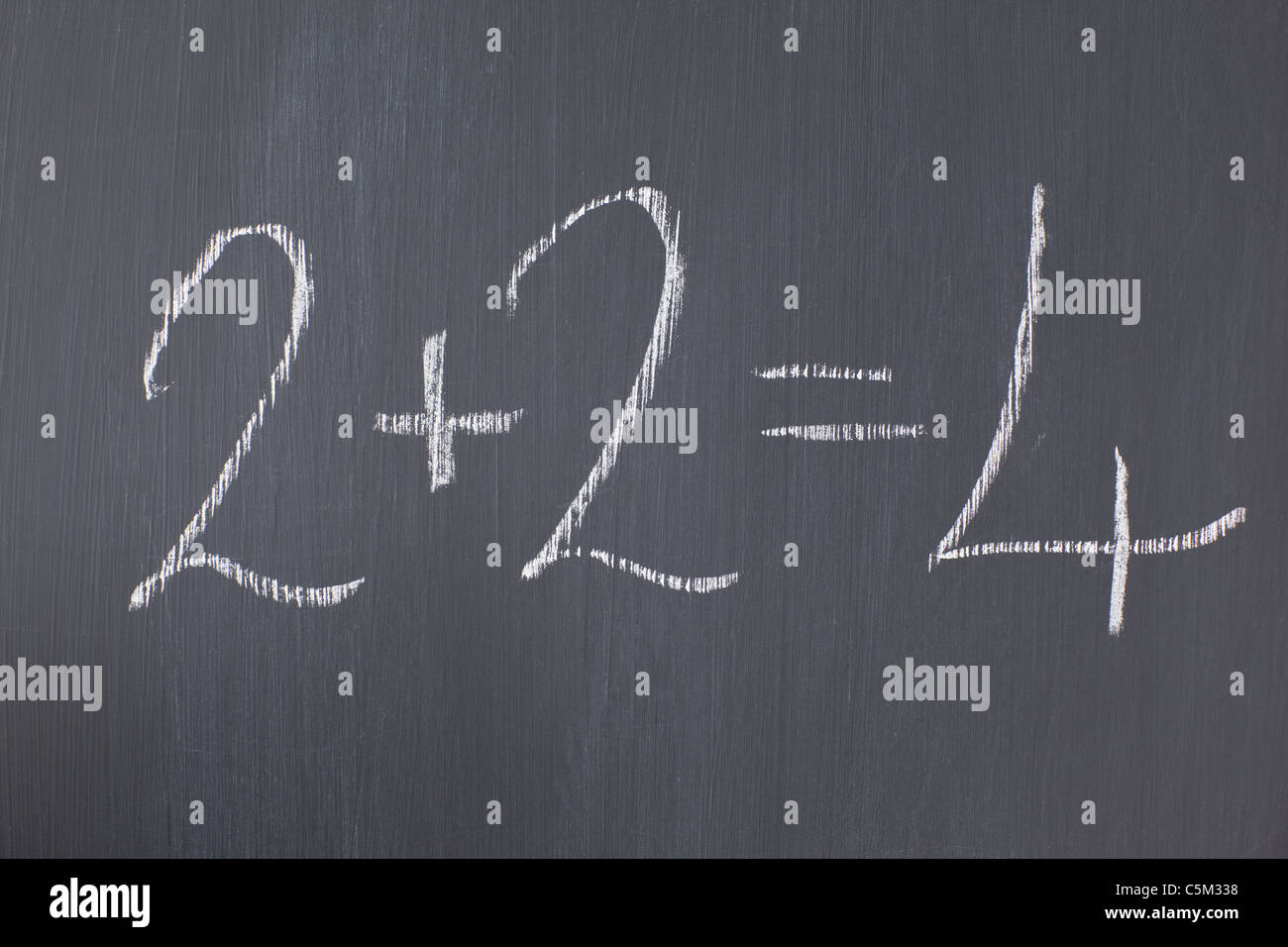 Blackboard with a simple addition written on it Stock Photo - Alamy