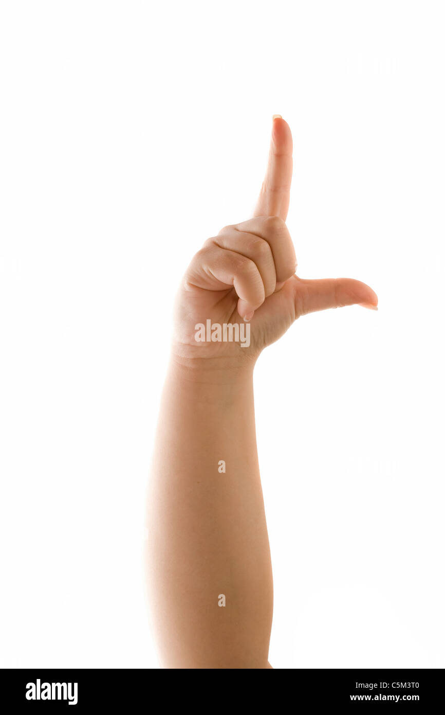 A hand holding up the loser sign or letter L with two fingers isolated over white. Talk to the hand! Stock Photo