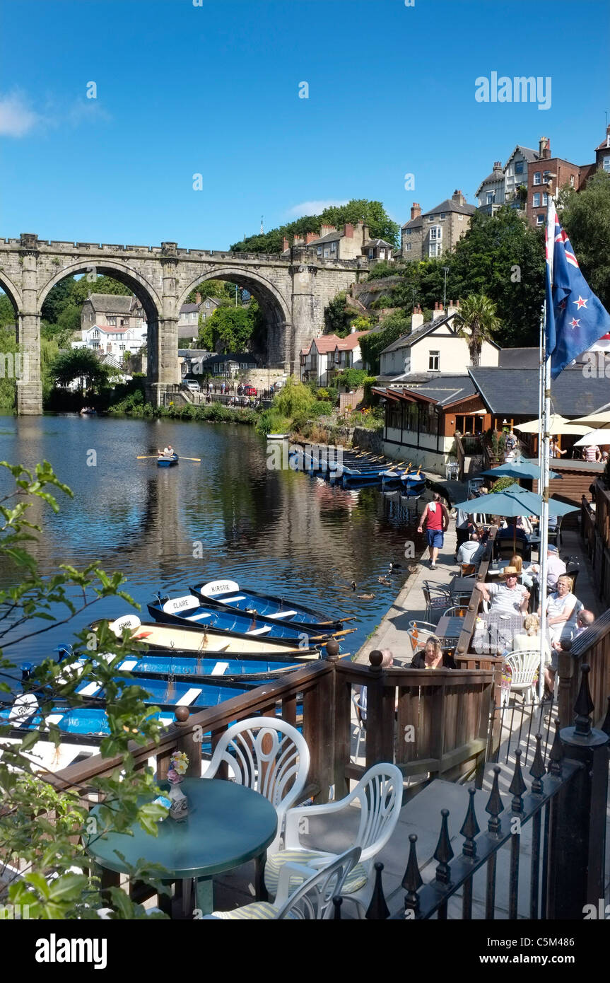The River Nidd at Knaresborough, North Yorkshire, straddled by a Stone Railway Viaduct. Viewed from the castle, with rowing boats in the foreground. Stock Photo