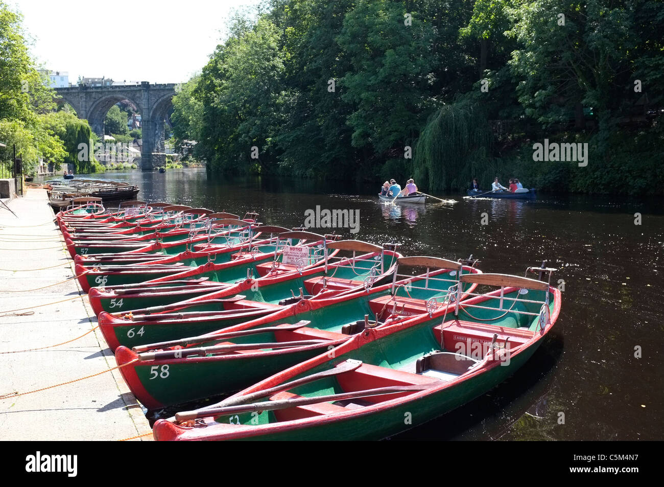 The River Nidd and rowing boats at Knaresborough straddled by a Stone