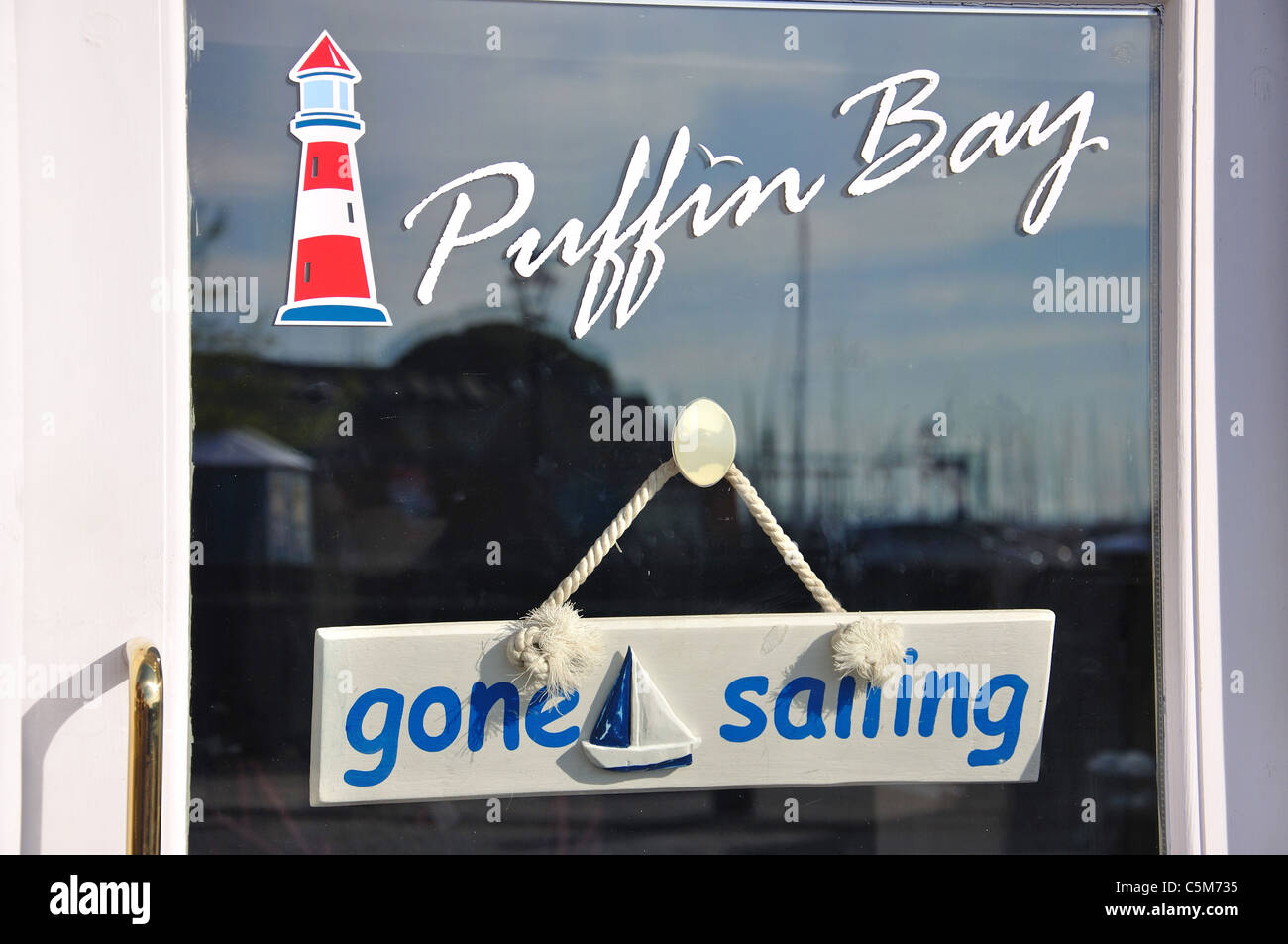 'Gone sailing' sign on shop window, Lymington Quay, Lymington, New