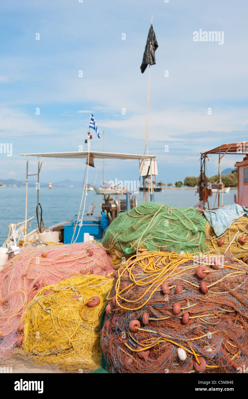 Greek fishing nets and boat in harbor from Nea Epidavros Stock Photo