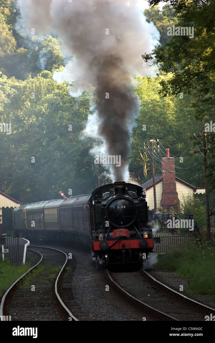 Steam Train bellowing smoke Stock Photo