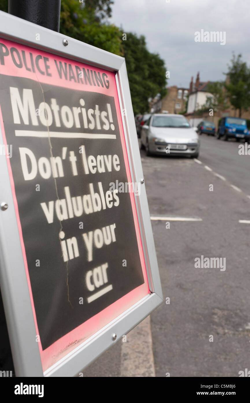 Police notice warning motorists not to leave valuables in your car. Inner city, London England. Stock Photo