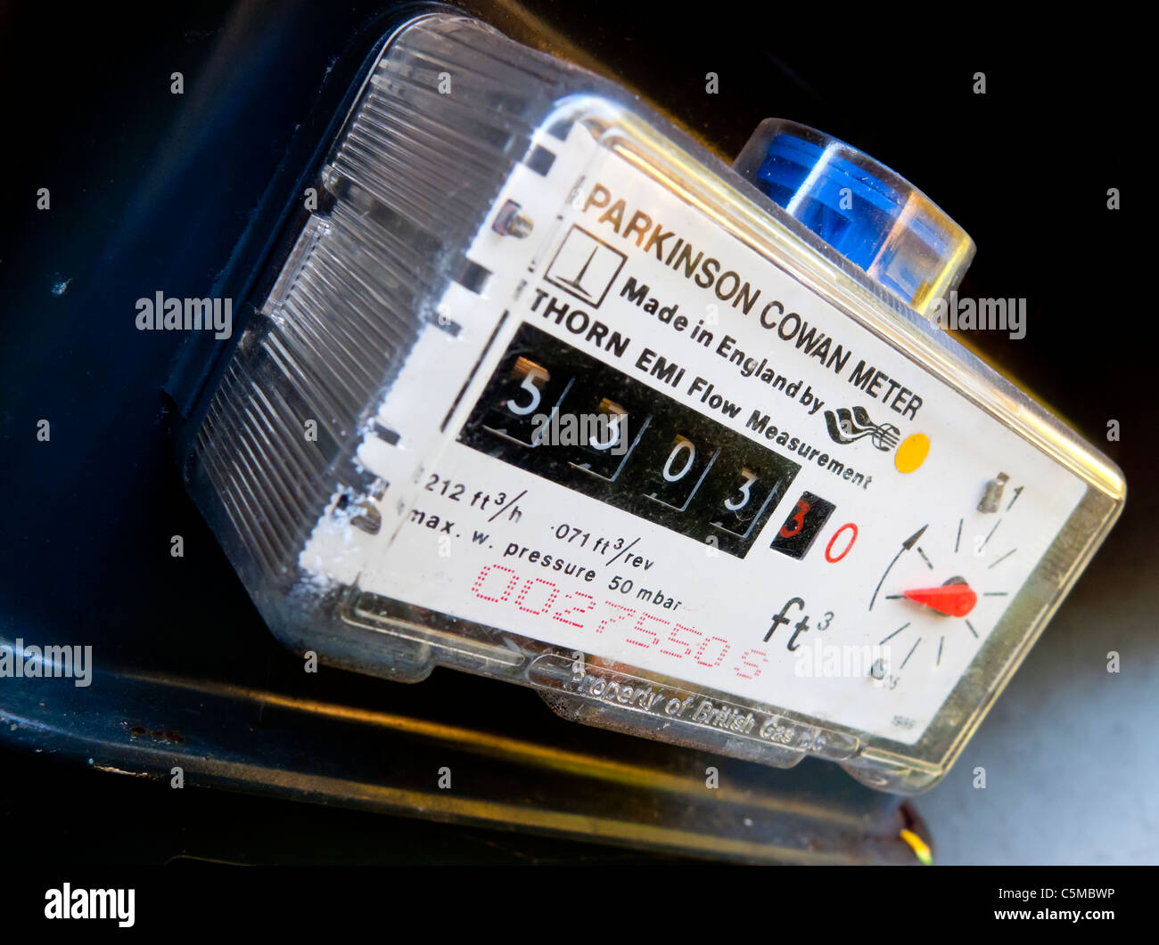 Close up view of domestic gas meter in a UK house showing dials and analogue display used to take readings Stock Photo