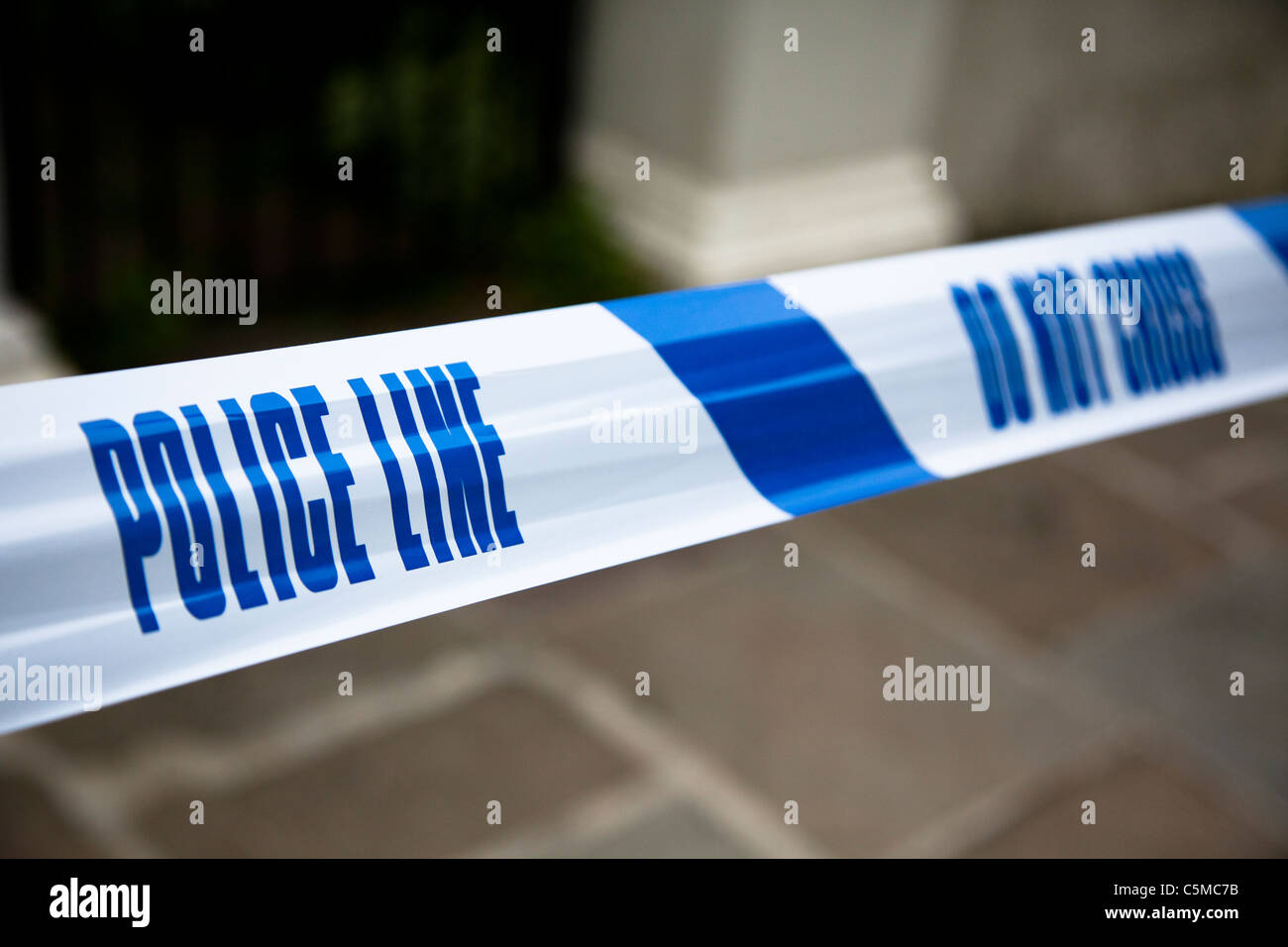 Police tape marking a cordoned off area. Stock Photo
