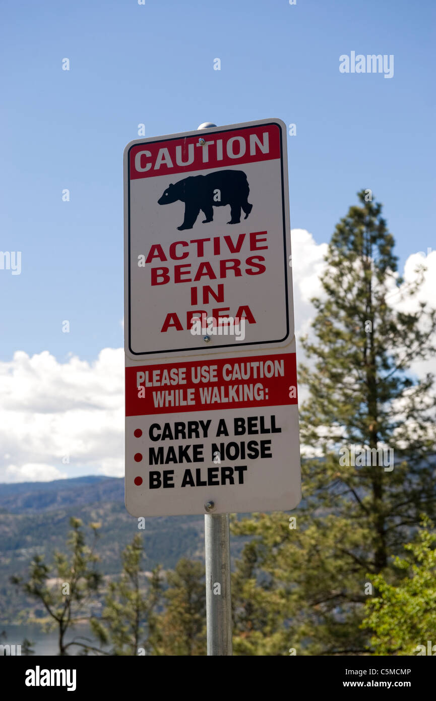 A bear warning sign above Okanagan Lake in Kelowna, Canada Stock Photo