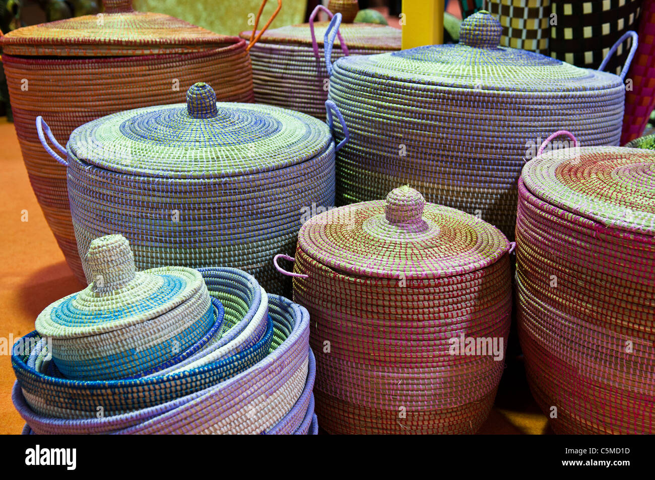 Colorful woven baskets with lids on a market stall Stock Photo - Alamy