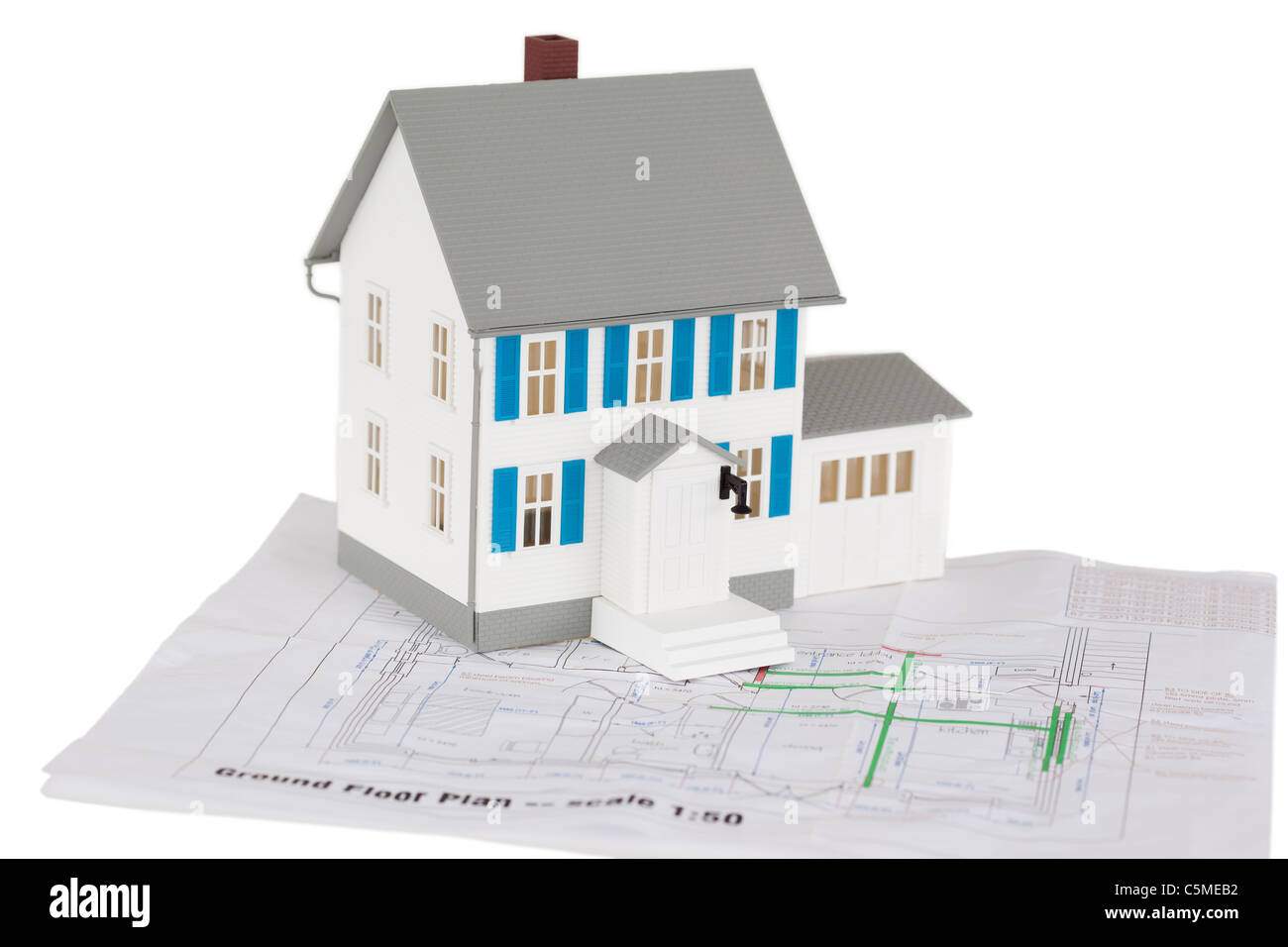 Gray toy house model on a ground floor plan Stock Photo