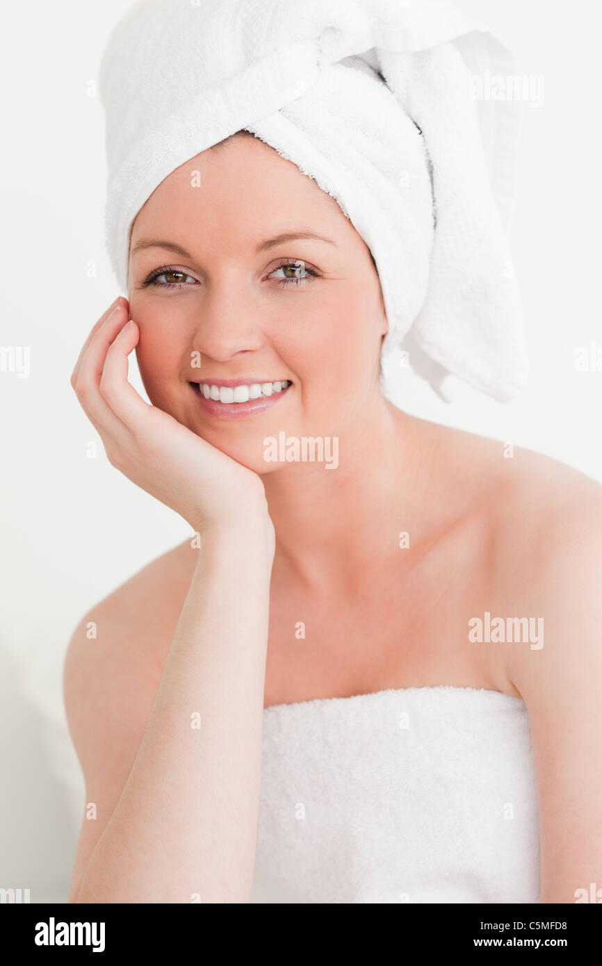Beautiful young female wrapped in a towel Stock Photo - Alamy