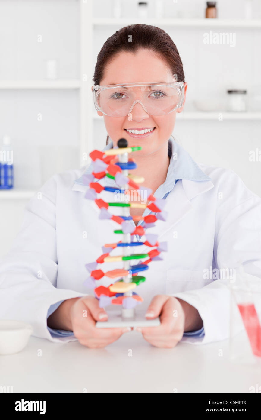 Young scientist showing the dna double helix model Stock Photo