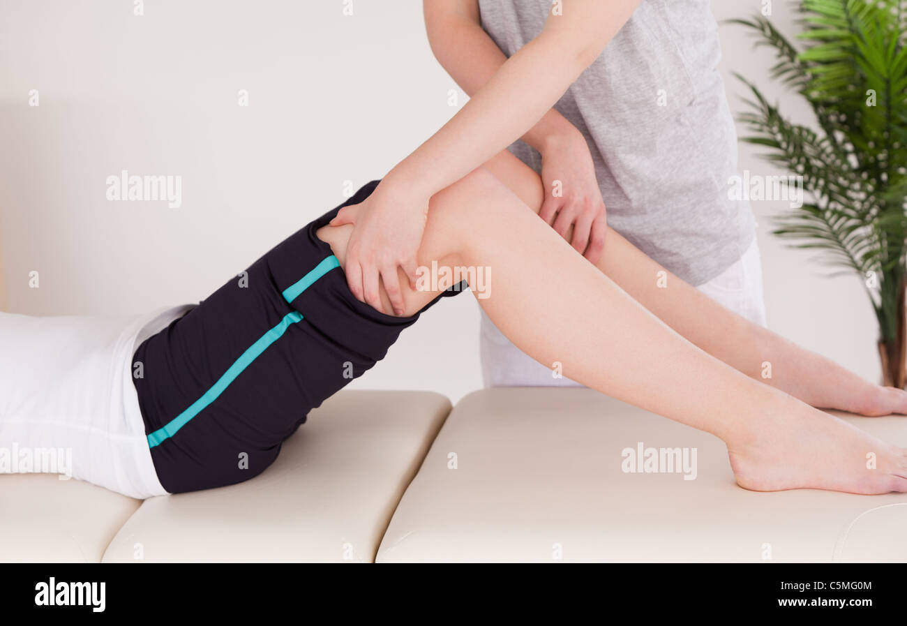 Young woman having a leg massage Stock Photo
