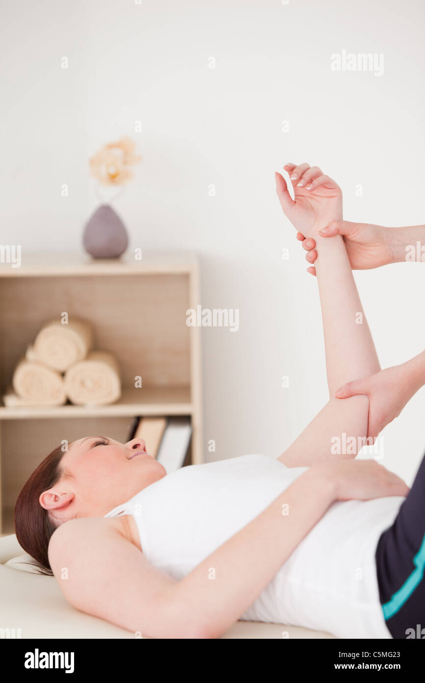 Portrait of a young woman having an arm massage Stock Photo