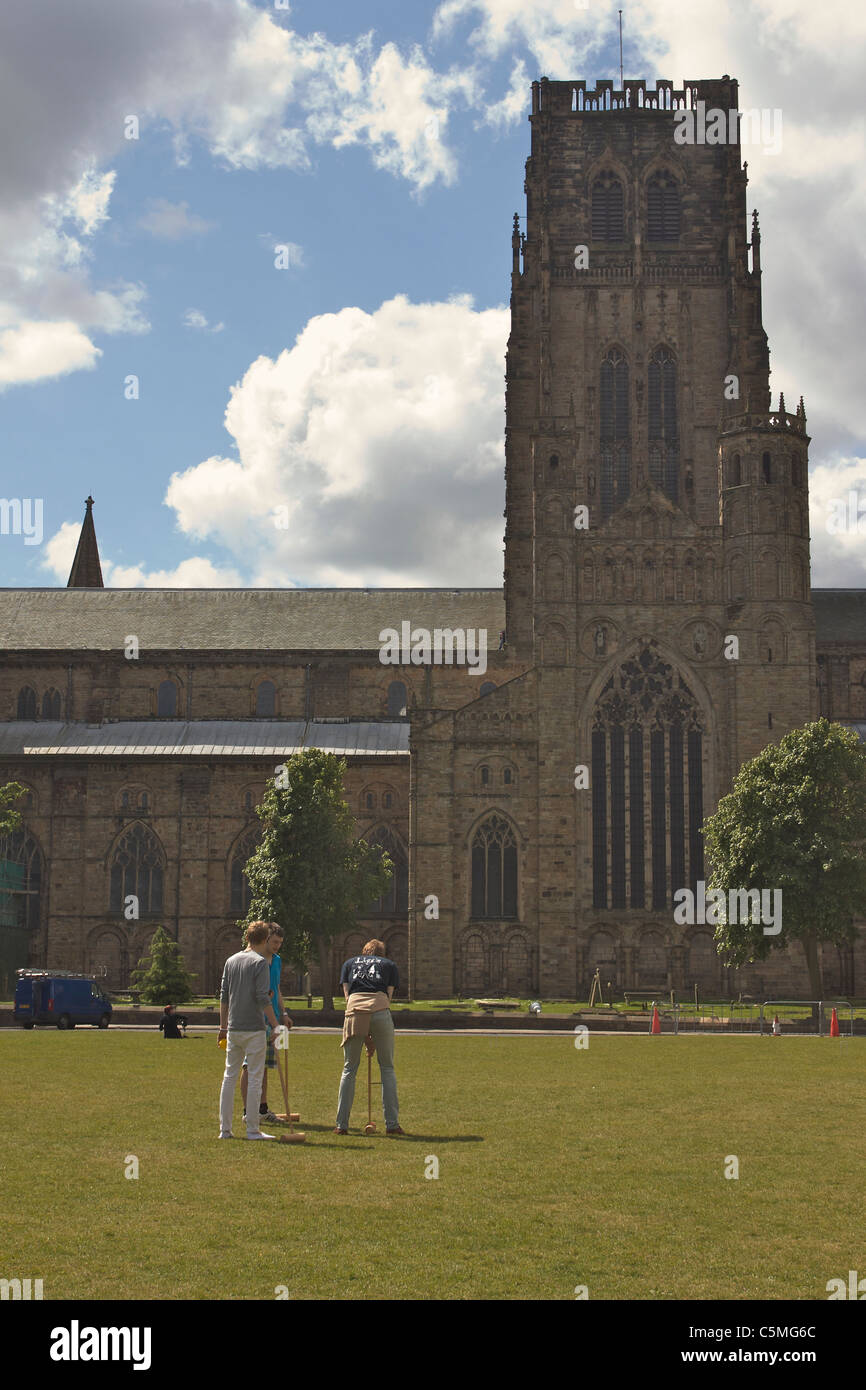 Students playing croquet on the green in front of Durham cathedral Stock Photo