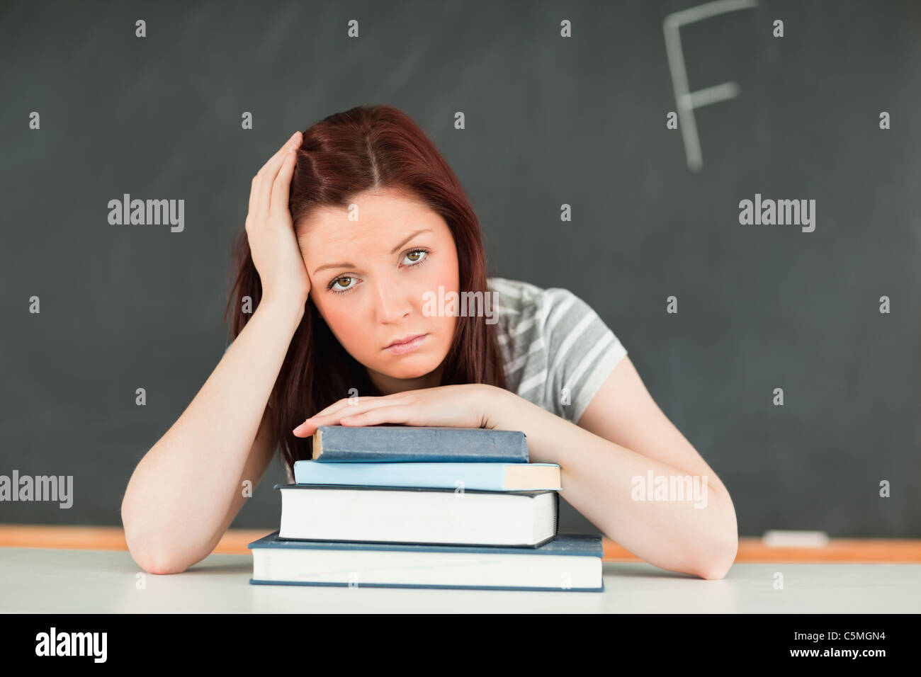 Sad young student receiving bad mark Stock Photo - Alamy