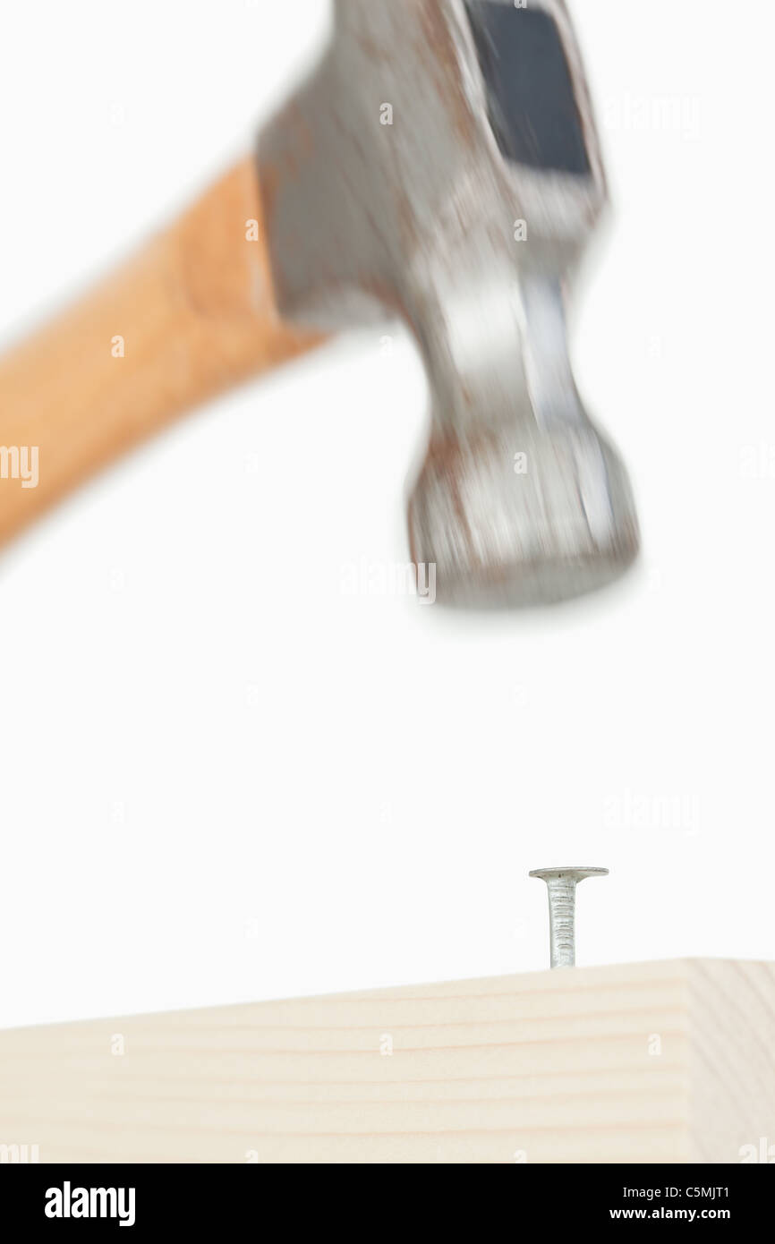 Close up of a hammer driving a nail Stock Photo Alamy