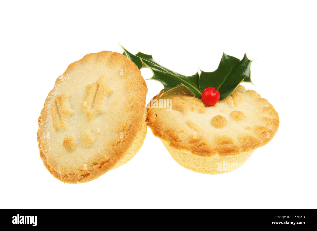 Two mince pies with a holly sprig isolated on white Stock Photo