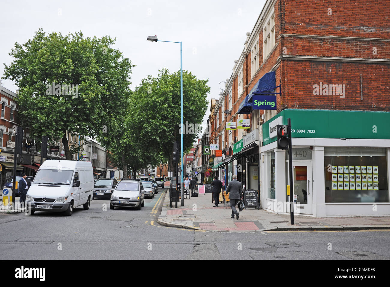 Traffic stops at lights in Chiswick High Road West London UK Stock Photo