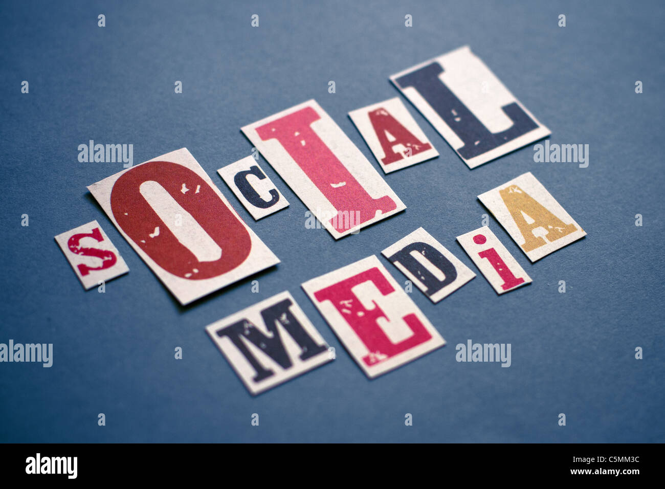 Social Network Concept. Caption composed with letters torn from magazines on the gray-blue paper. Stock Photo