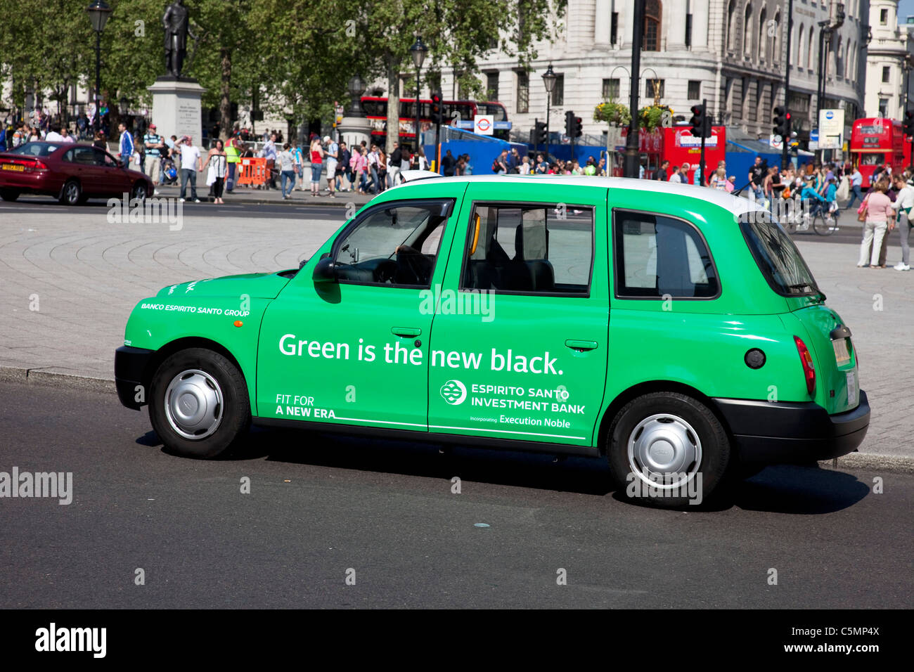 Green London taxi cab advertising says 'Green is the new black' Stock Photo Alamy
