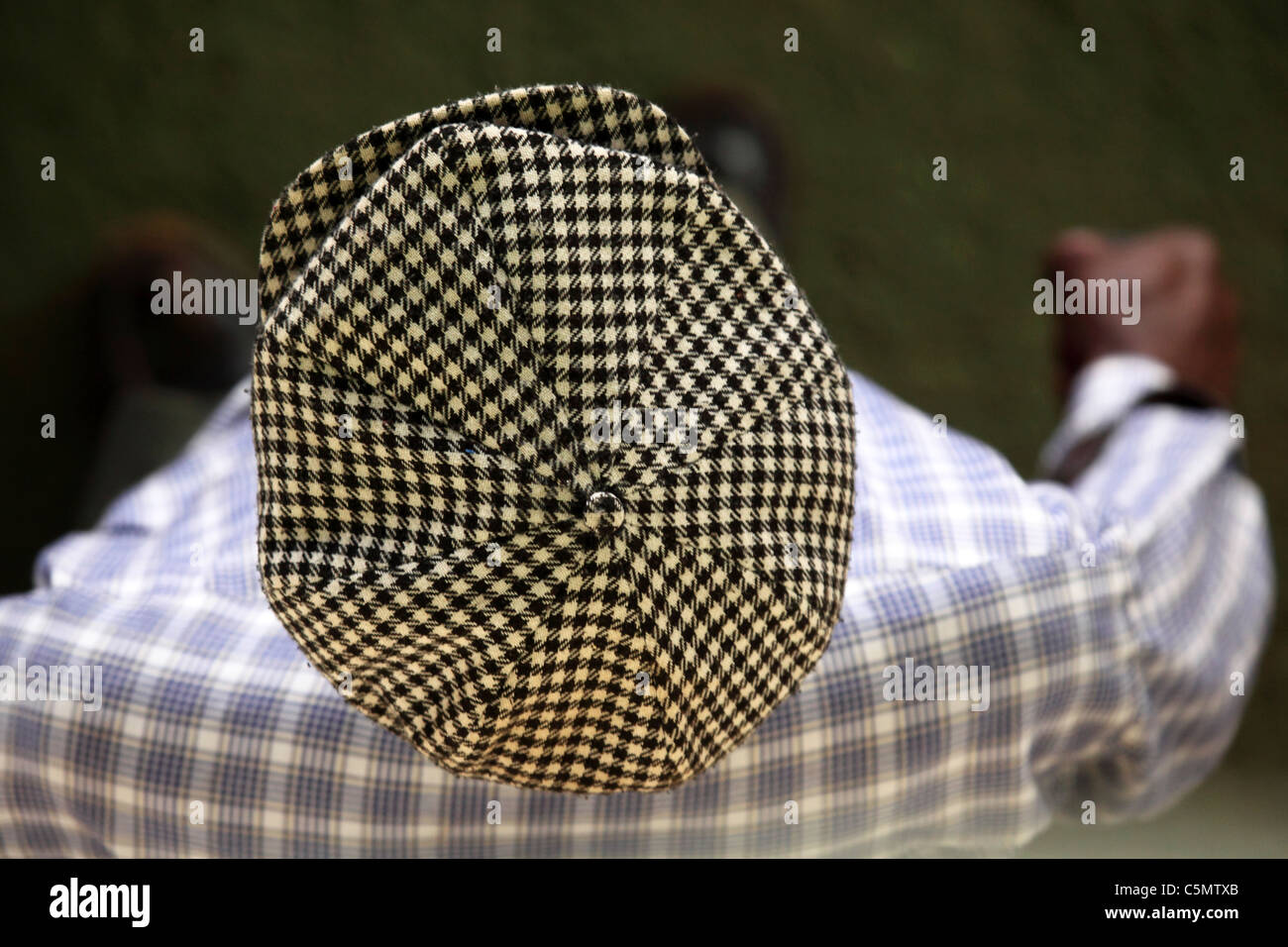 A man in a flat checked cap in Harare, Zimbabwe. Stock Photo