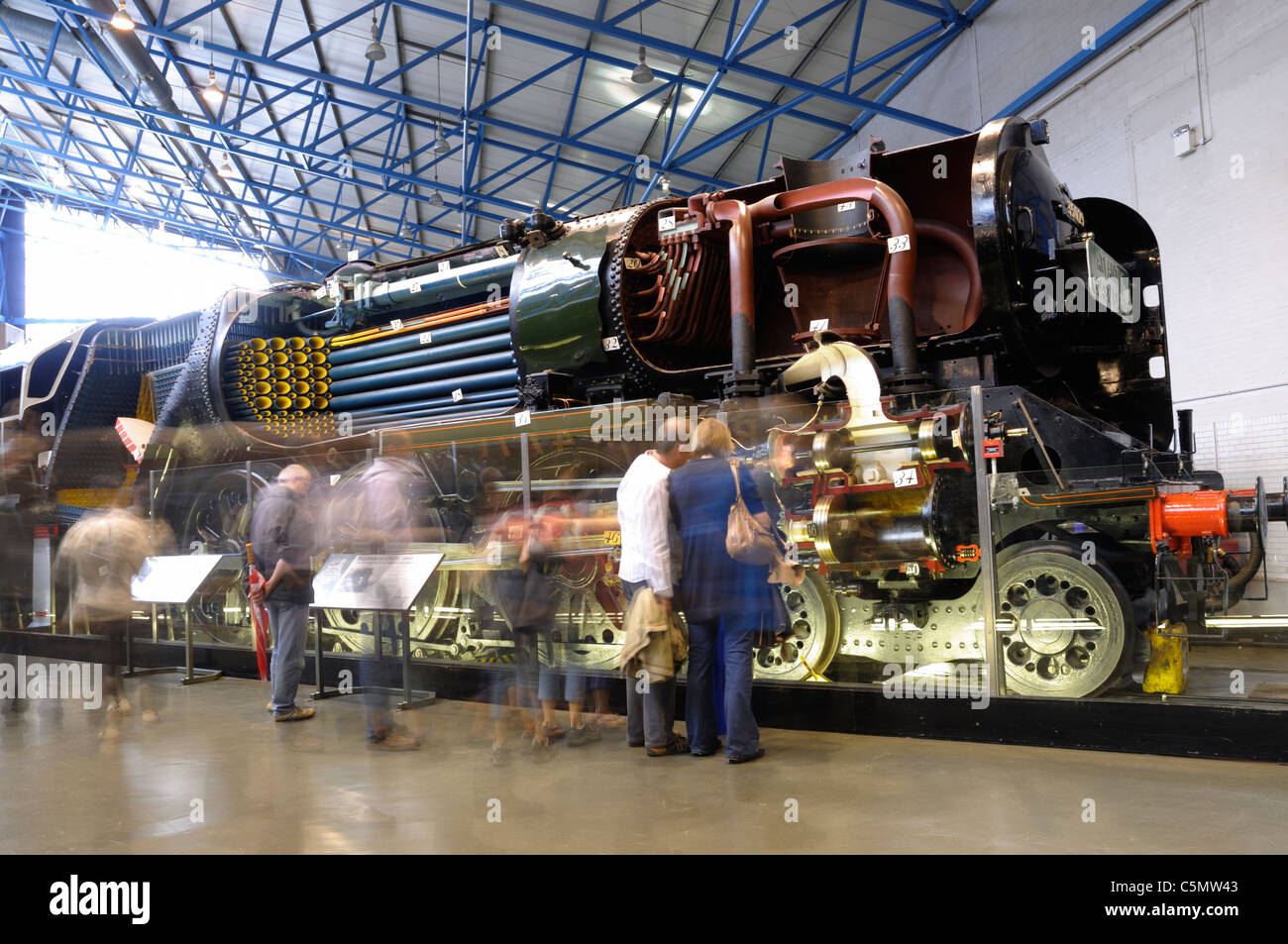 View of sectioned Merchant Navy class No 35029 'Ellerman Lines' at the  National Railway Museum in York with visitors around it. Stock Photo