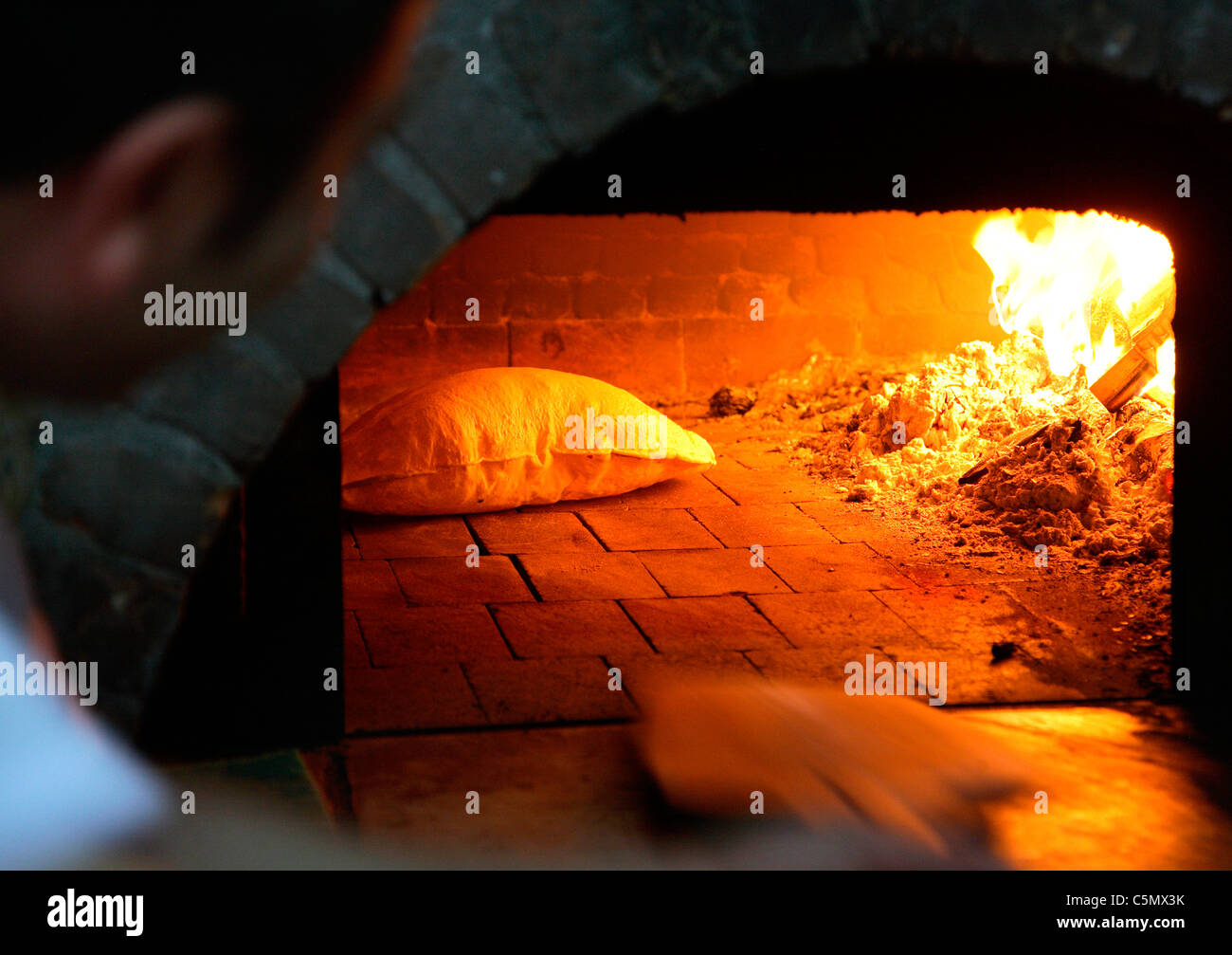 Turkish bread in wood fired oven Stock Photo Alamy