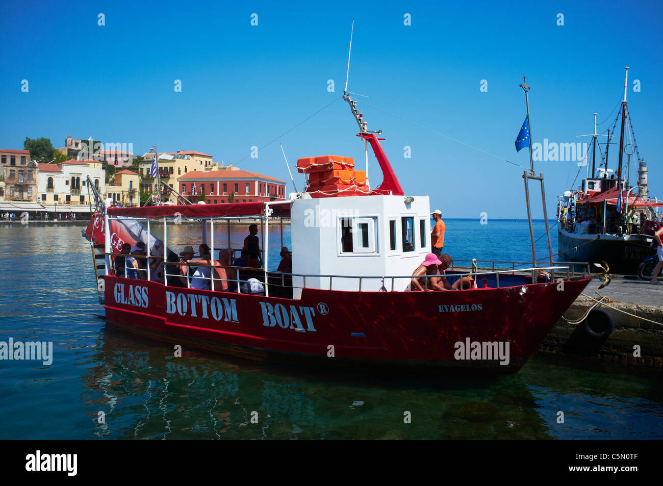 Glass bottom boat within the old harbour of Chania Crete Stock Photo - Alamy