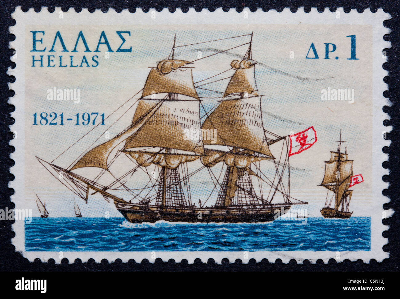 A postmarked Greek stamp showing a ship with sails Stock Photo