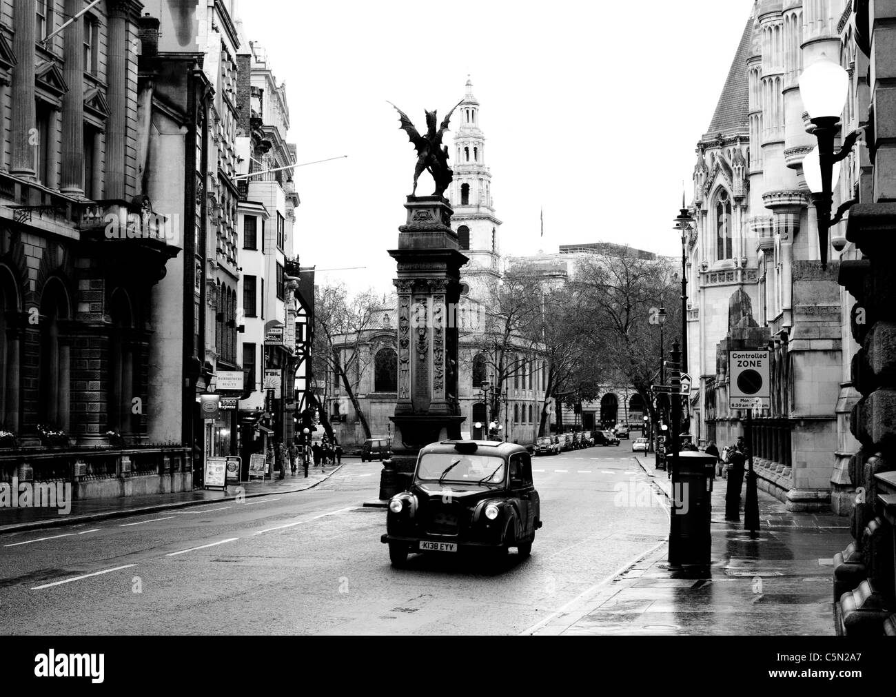 London Cab Against the Dragon of Fleet Street Black&White Stock Photo