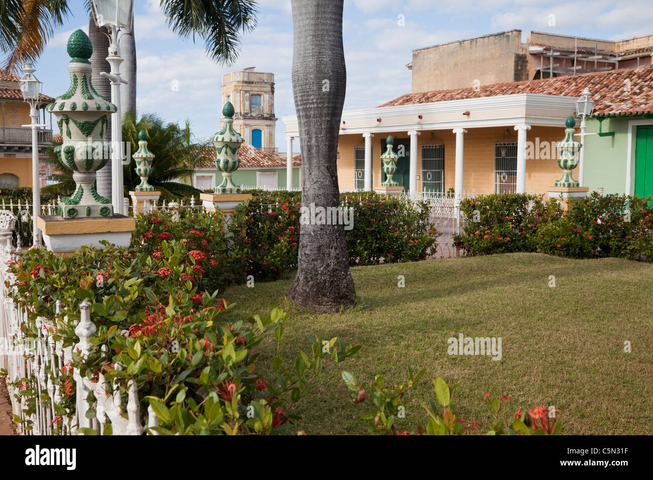 Cuba, Trinidad. Plaza Mayor. Tower of the Palacio Cantero in rear center, now the Museo Historico Municipal. Stock Photo