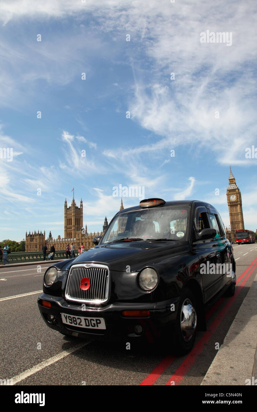 A London taxi on Westminster Bridge, Westminster, London, England, U.K. Stock Photo