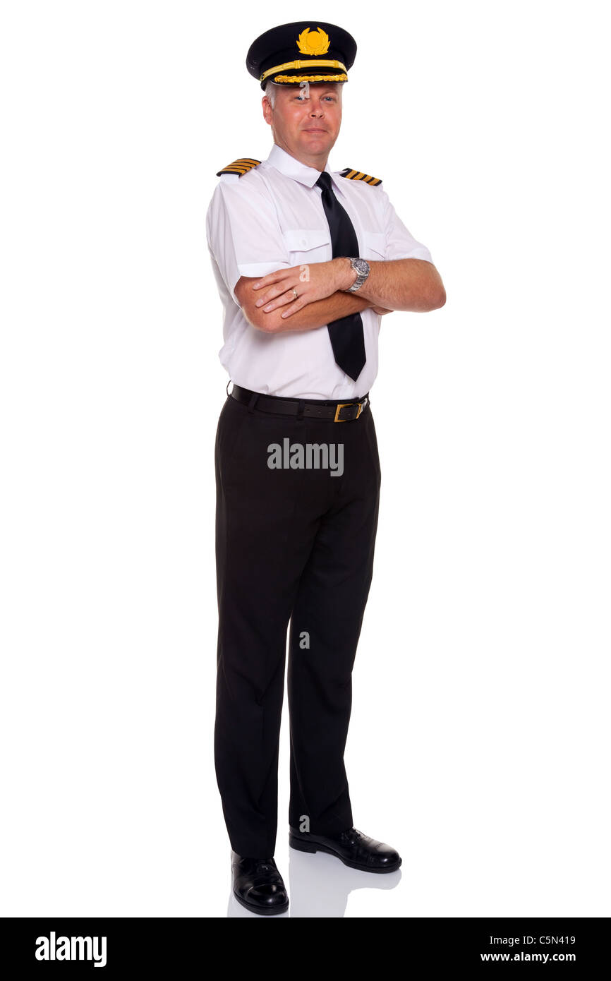 Photo of an airline pilot wearing the four bar Captains epaulettes arms folded, isolated on a white background. Stock Photo