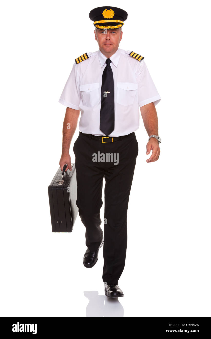 Photo of an airline pilot wearing the four bar Captains epaulettes walking towards camera Stock Photo