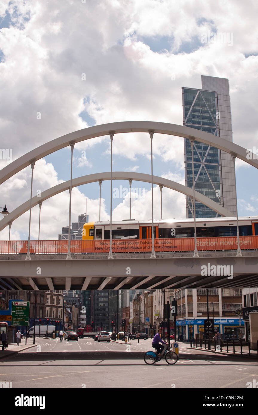 An overland train on the new East London Line extension crossing the bridge over Shoreditch High Street, East London. Stock Photo