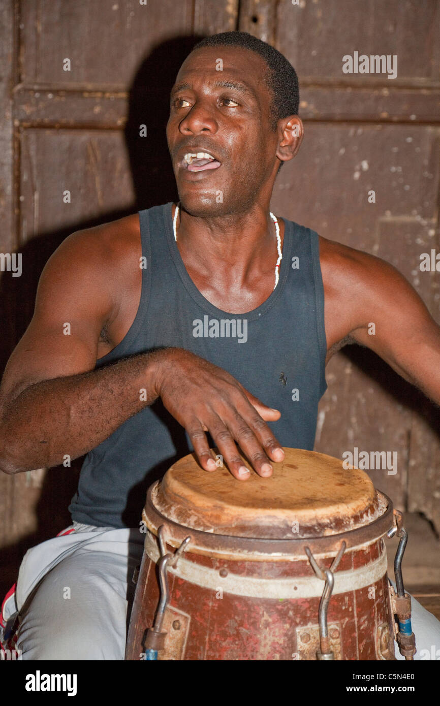 Cuba, Trinidad. Drummer in Afro-Cuban Religious Ceremony of Congolese Origin. Stock Photo