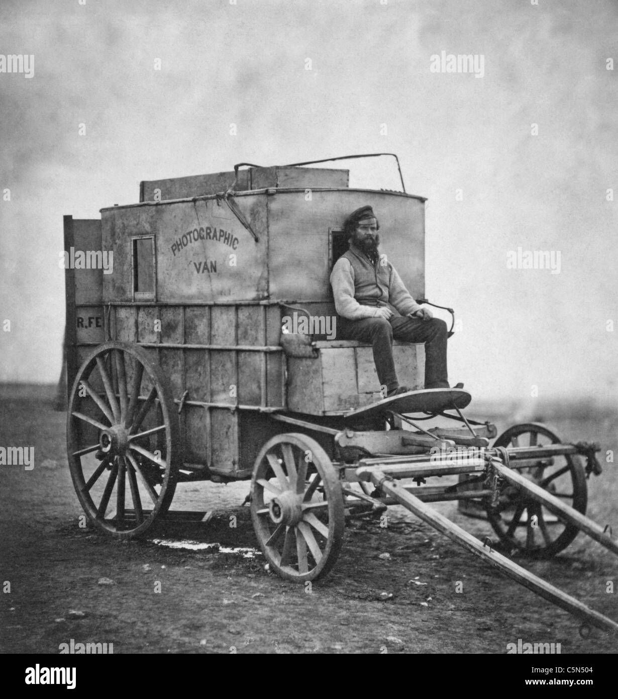 Artist's Van -  Marcus Sparling, full-length portrait, seated on Roger Fenton's photographic van, during the Crimean War, 1855 Stock Photo