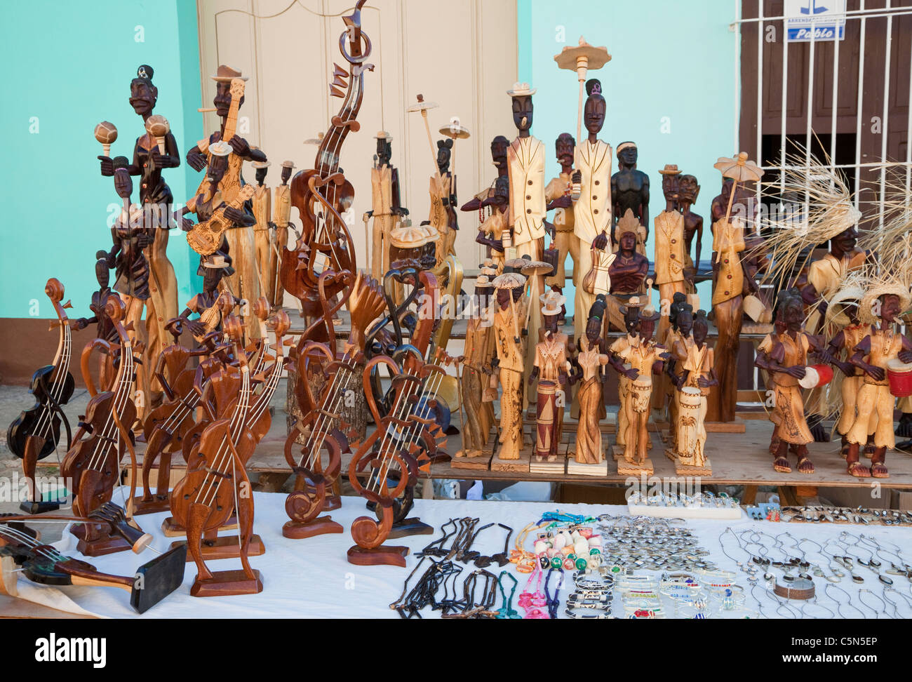 Cuba, Trinidad. Wood Carvings in Handicrafts Market. Stock Photo