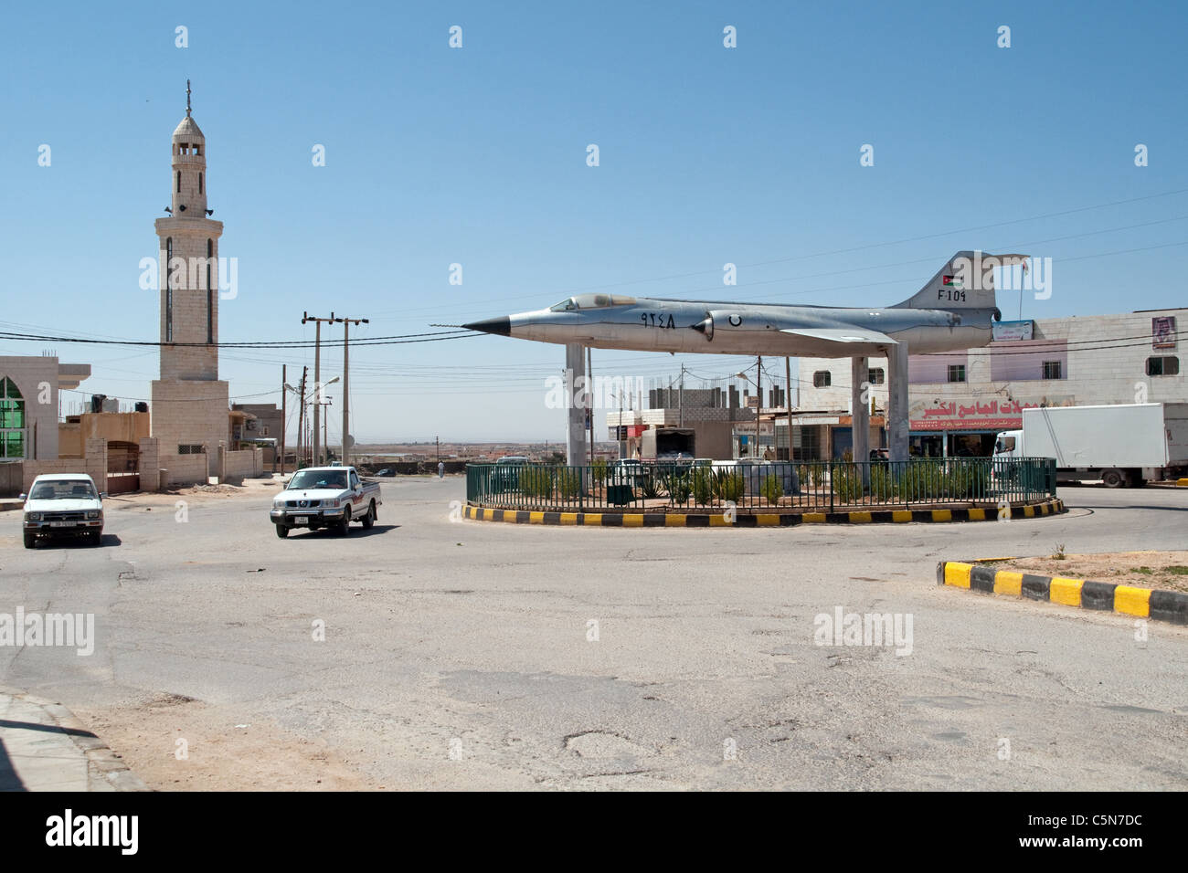 An F-104 starfighter, tops a roundabout in a village in the al-Mafreq region of northern Jordan, near its border with Syria. Stock Photo