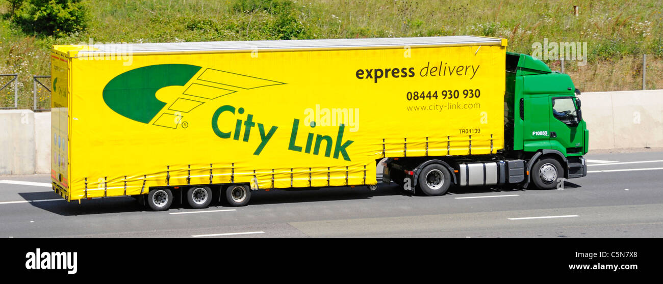 City Link transport business operating express parcel delivery advert branding & logo side of articulated trailer hgv lorry truck driving on UK road Stock Photo